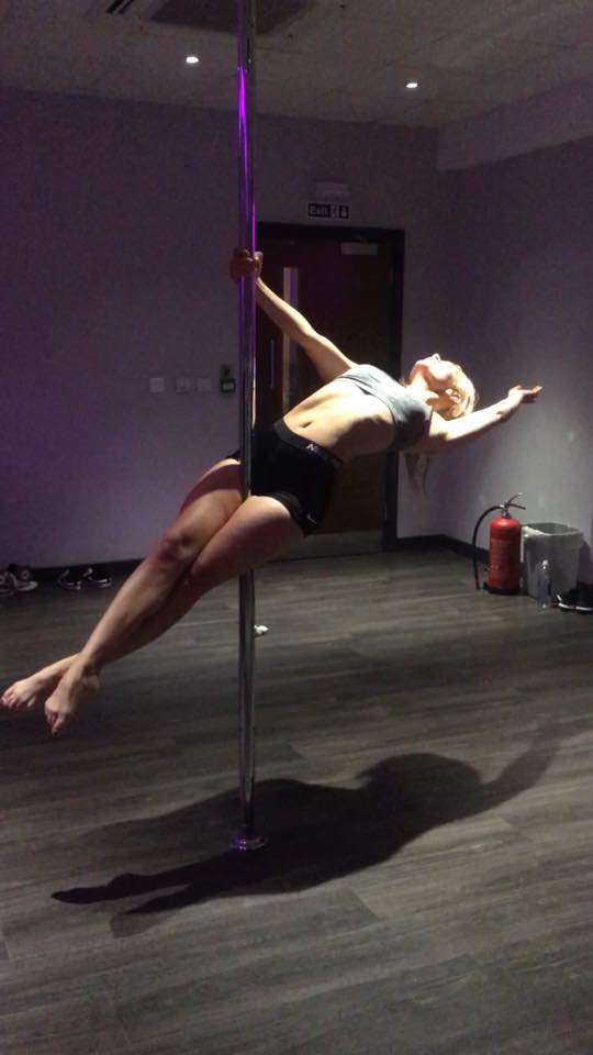 Students in a group pole class
